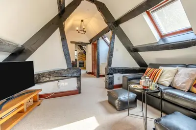 a living room with a couch and a flat screen tv at 2 Bed in Llangorse oc-p31754 in Llangorse