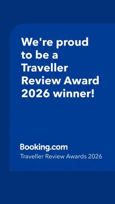 a blue sign that says were proud to be a traveller reviewagency winner at POD6 Family Glamping with seaview & Wi-Fi in Llwyngwril