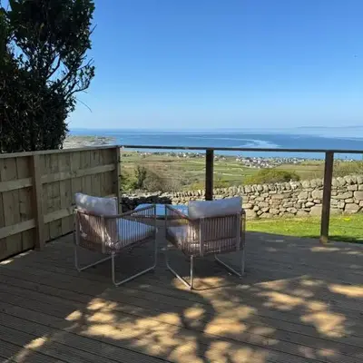 coastal view shepherds hut with hot tub