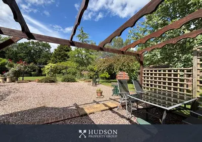 a gazebo with two chairs in a yard at Private Cottage in Shrewsbury in Shrewsbury