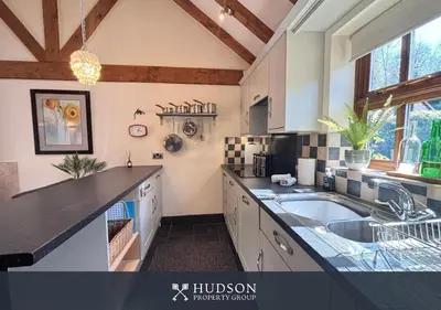 a kitchen with a sink and a counter top at Private Cottage in Shrewsbury in Shrewsbury
