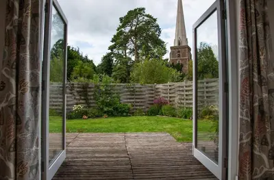 an open window with a view of a yard at Beautiful Cabin Near Hay-on-Wye in Peterchurch