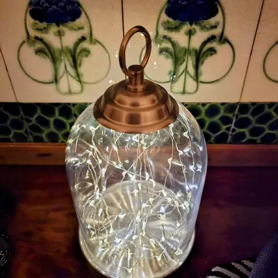 a glass kettle with a glass cover on a table at Cosy Cottage in Kington