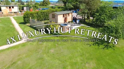a sign that reads ay luxury huts retreat in a park at Unplug & Reconnect, Romantic Retreat with Hot Tub in Yarpole