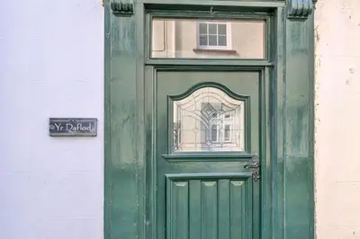 a green door with a window on a building at Finest Retreats - Yr Daflod in Brecon