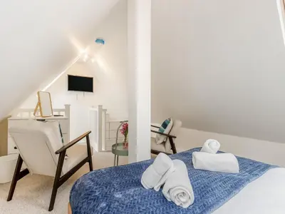 a white room with a bed with towels on it at The Little House - Uk49129 in Stapleton