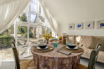 a dining room with a table and a large window at 1 Bed in Culmington oc-t31830 in Culmington
