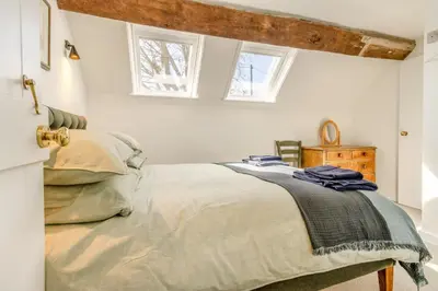 a bedroom with a bed and two windows at 1 Bed in Culmington oc-t31830 in Culmington