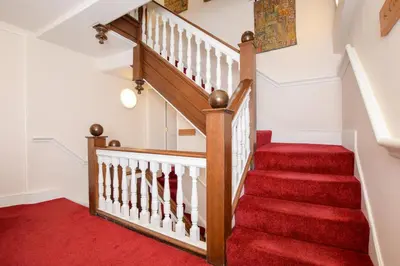 a staircase with red carpeting and a red rug at 2 Bed in Ludlow oc-c31883 in Ludlow