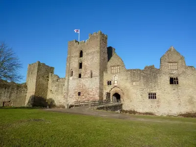 an old castle with a flag on top of it at 2 Bed in Ludlow oc-s31884 in Ludlow