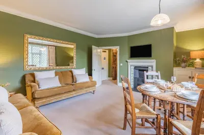 a living room with a table and a couch at 2 Bed in Ludlow oc-s31884 in Ludlow