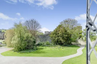 a view of a garden with a castle in the background at 2 Bed in Ludlow oc-p31882 in Ludlow