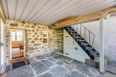 an old stone building with a staircase in a room at 3 Bed in Dolgellau oc-h31822 in Dolgellau
