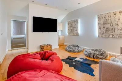 a living room with a couch and a flat screen tv at 6 Bed in Llanwern oc-w31947 in Brecon