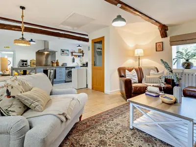 a living room with a couch and a table at 2 Bed in Llanon oc-96072 in Pennant