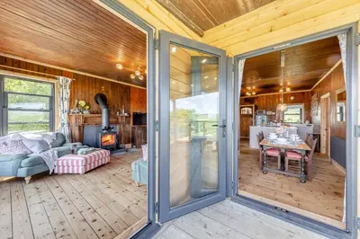 a living room with a sliding glass door at 3 Bed in Barmouth oc-c31942 in Barmouth