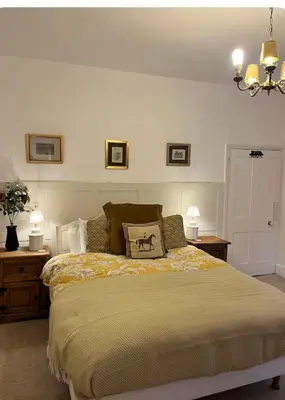 a bedroom with a bed with a pillow on it at Oaklands Farm in Preesgreen