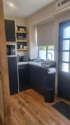 a kitchen with a sink and a counter top at The Old Shop High Street in Llanidloes