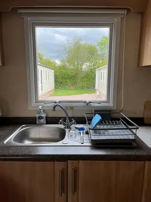 a kitchen counter with a sink and a window at Sylvan Near Hay on Wye in Rhos-gôch