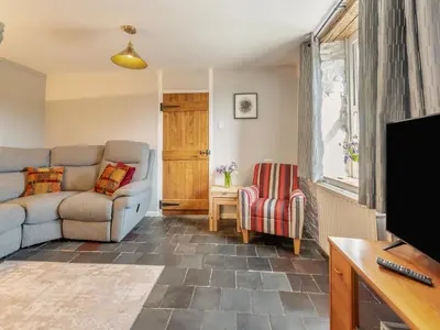 a living room with two chairs and a tv at West Llwyn - Uk41757 in Rhyd Owen