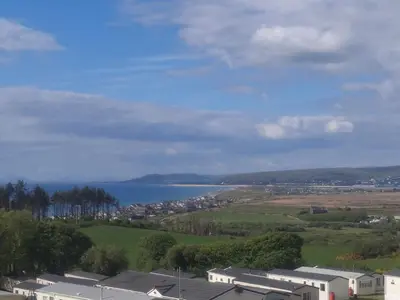 a view of a city and a body of water at 'Falcons Rest' in Borth