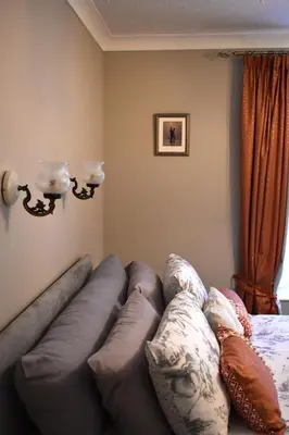 a living room with a couch and pillows at Lion Royal Hotel, Rhayader in Rhayader