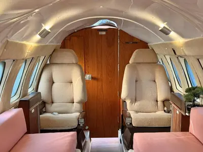 two empty seats in the back of an airplane at Alaya Airways in Dolgellau