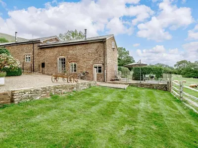 a brick building with a yard in front of it at 1 Bed in Hereford oc-42897 in Craswall