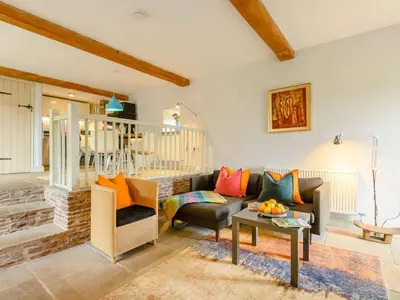 a living room with a couch and a table at 1 Bed in Hereford oc-42897 in Craswall