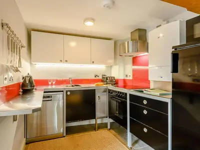 a kitchen with stainless steel appliances and red at 1 Bed in Hereford oc-42897 in Craswall