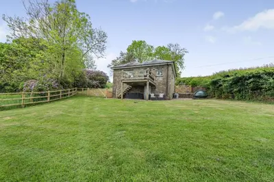 a house in a field with a grass yard at 1 Bed in Brynteg oc-g32079 in Llanwenog