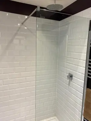 a shower with a glass door in a bathroom at 4 bedroom farmhouse Brecon Beacons in Talgarth