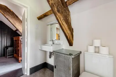 a bathroom with a sink and a toilet at 4 bedroom farmhouse Brecon Beacons in Talgarth