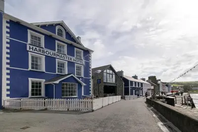 a blue building on the side of a street at 2 Bed in Aberaeron oc-bow173 in Aberaeron