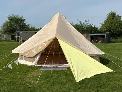 a large tent in the grass in a field at 5 Metre 'UNFURNISED' Bell Tent in Ball
