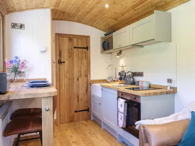 a small kitchen with a sink and a stove at Celyn in Dolgellau