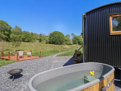 a bath tub in the side of a building at Celyn in Dolgellau