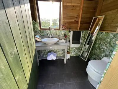 a bathroom with a sink and a toilet at Hinton land glampsite in Peterchurch