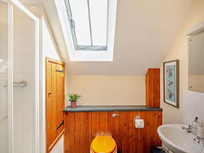 a bathroom with a toilet and a sink and a skylight at 2 Bed in Craven Arms oc-96046 in Tugford