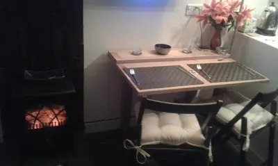 a table and a chair in a room with a desk at Parkway Chalet - Pennal, Powys, Wales nr Aberdovey in Pennal
