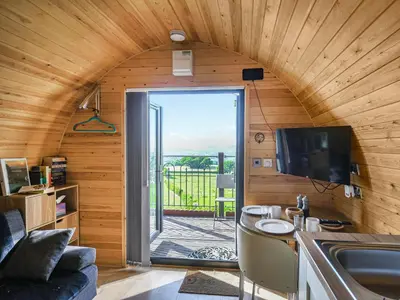 a kitchen and living room in a tiny house at Luna Holiday Pod - Uk48590 in Church Stretton