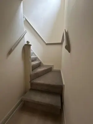 a stairway with stairs with a skylight at Brewe's Loft in Farden