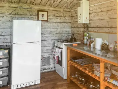 a kitchen with a white refrigerator and a stove at Tilly - Uk49798 in Brecon
