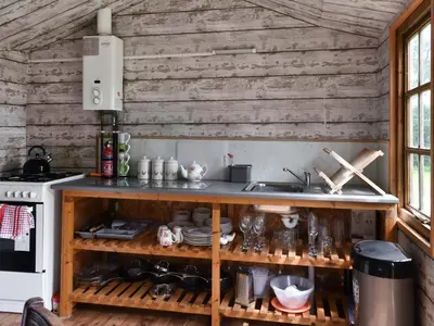 a kitchen with wooden walls and a counter at Tilly - Uk49798 in Brecon