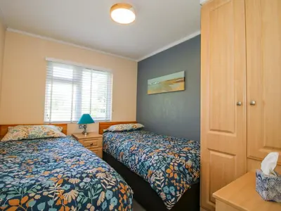 a bedroom with two beds and a window at Dunromin in Montgomery