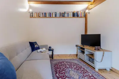 a living room with a couch and a flat screen tv at 1 Bed in Dorstone oc-c31765 in Dorstone