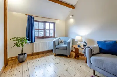 a living room with a couch and a chair at 1 Bed in Dorstone oc-c31765 in Dorstone