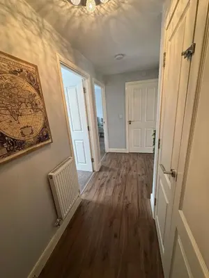 an empty hallway of a home with a hallway at Town centre abode with gated parking in Shrewsbury