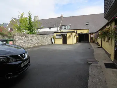 a car parked in the driveway of a house at Borderers Inn in Brecon
