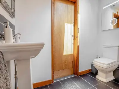 a bathroom with a sink and a toilet at Sheep Shed - Uk49794 in Cribyn